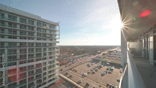 Kerr st and spears rd. Oakville Ontario cars driving by  sunny day blue sky grocery store and condo in view 