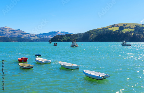 Obraz na płótnie Dinghy and Boats at Akaroa Beach on the Banks Peninsula, southeast of Christchurch, South Island, New Zealand w salonie