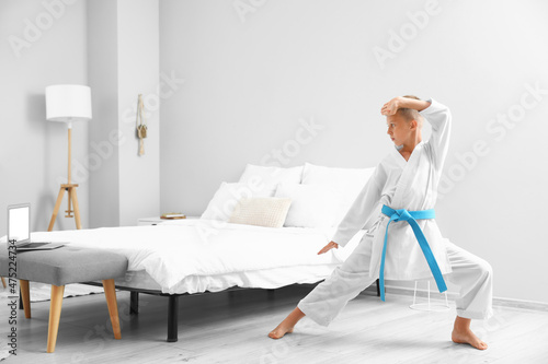 Little boy studying karate ...