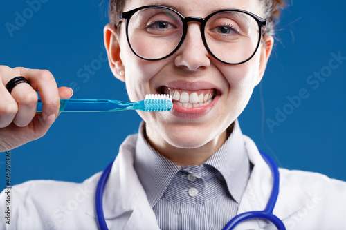 doctor shows how to use a toothbrush