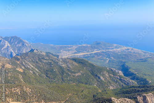 View of the Taurus mountains and the Mediterranean sea from a top of Tahtali mountain near Kemer, Antalya Province in Turkey © olyasolodenko