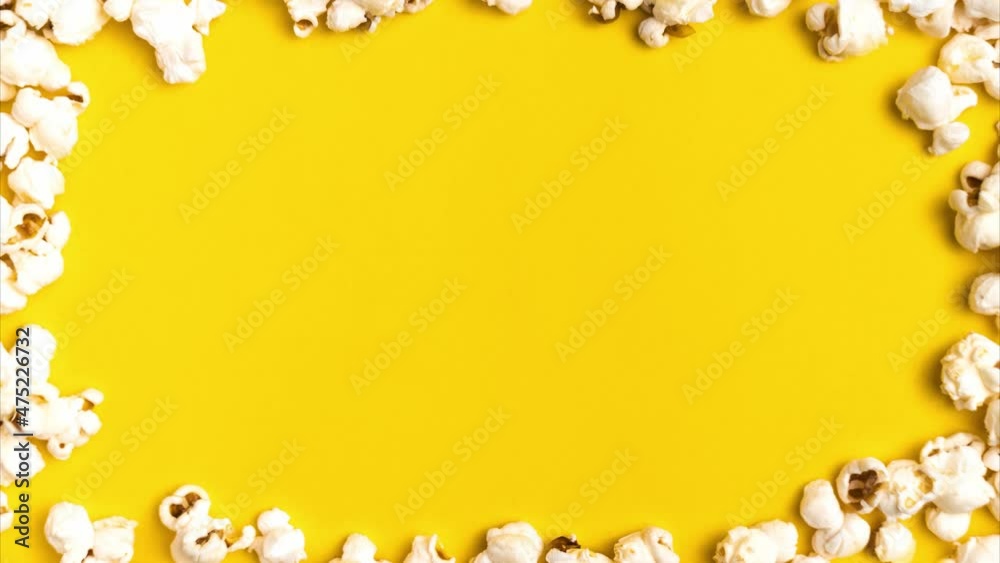 Looped Stop motion animation with popcorn frame appearing and disappearing on yellow background. Copy space for text