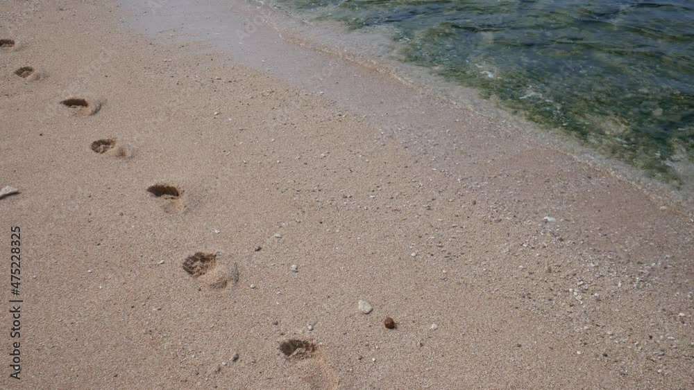 Footprint on the white sand on the beach Footprint on the white sand on the beach