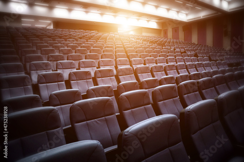 row of chairs in auditorium photo