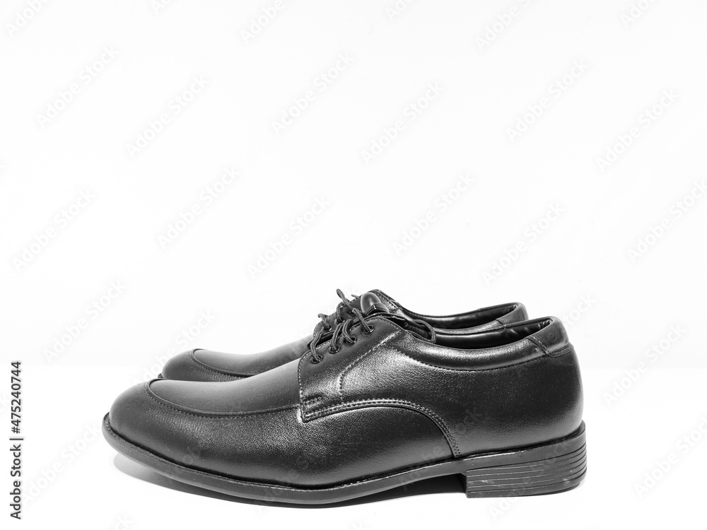 A pair of formal black shoes with laces displayed with white background
A pair of formal black shoes with laces displayed with white background