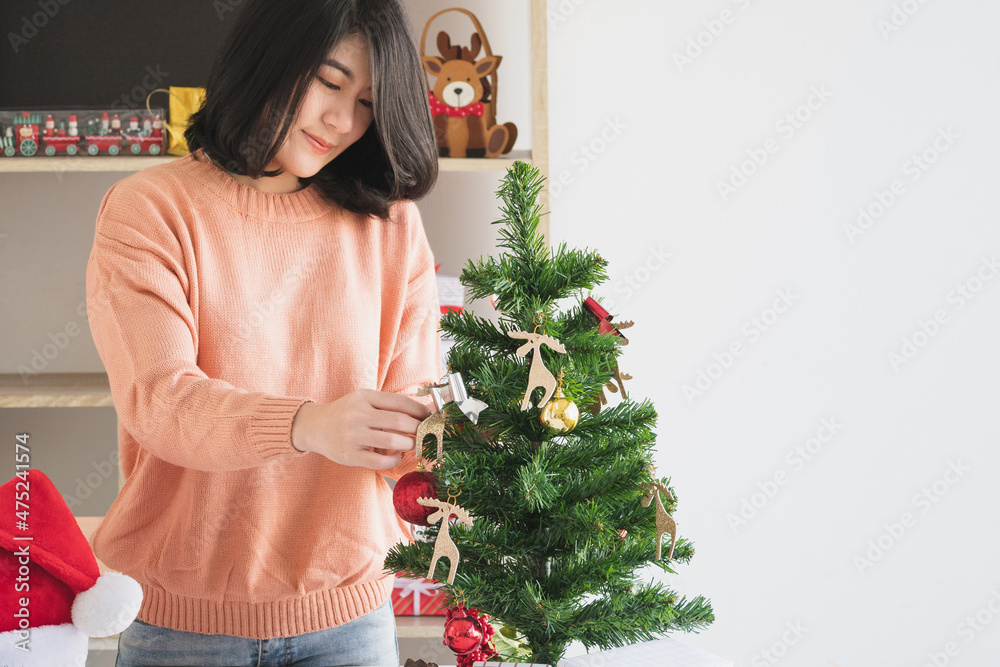 young asian woman prepare decorating for christmas and new year celebration young asian woman prepare decorating for christmas and new year celebration