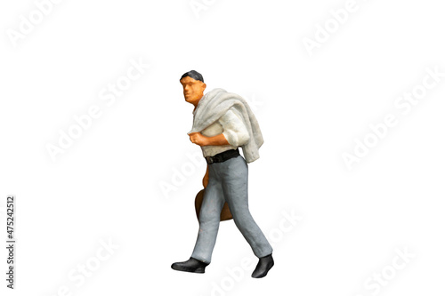 Miniature people holding a luggage on white background with clipping path