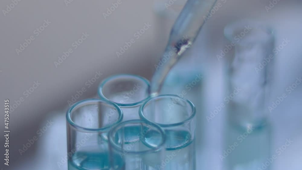 DNA analysis carefully drips the solution from the pipette into glass . DNA analysis carefully drips the solution from the pipette into glass .
