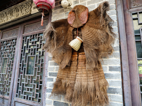 Coir raincoat of fishermen by the sea photo