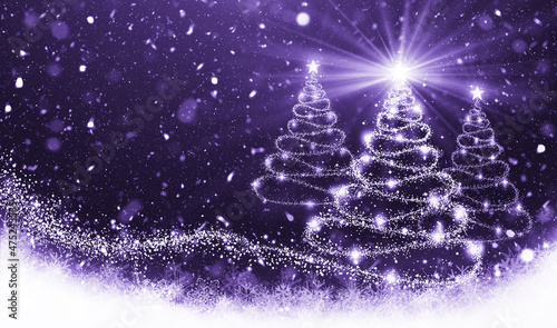 Christmas shining tree on festive background trendy color of the year 2022 very peri. Christmas ornaments and New Year decor.