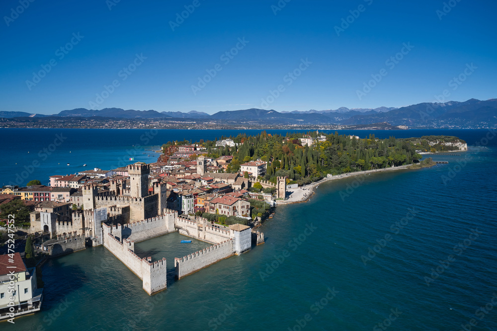 Sirmione aerial view. Top view, historic center of the Sirmione peninsula, lake garda. Autumn in Sirmione. Lake Garda, Sirmione, Italy. Italian castle on Lake Garda. Aerial panorama of Sirmione.