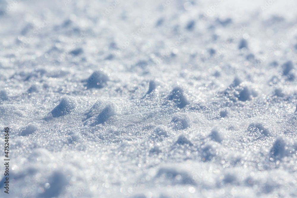 Snow surface close-up. Shallow depth of field and blur. Winter background. Snow surface close-up. Shallow depth of field and blur. Winter background.