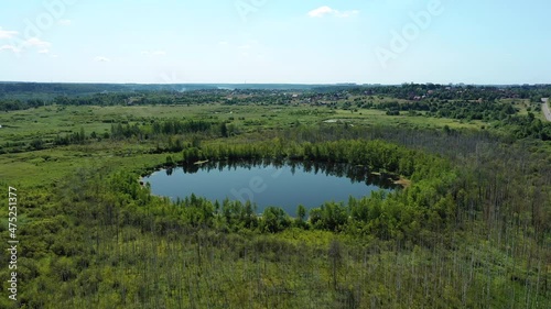 Aerial view of Bottomless  Lake in forest of Solnechnogorsk District, Moscow region. Russia. Aerial view. The lake is perfectly round and its depth is not determined.