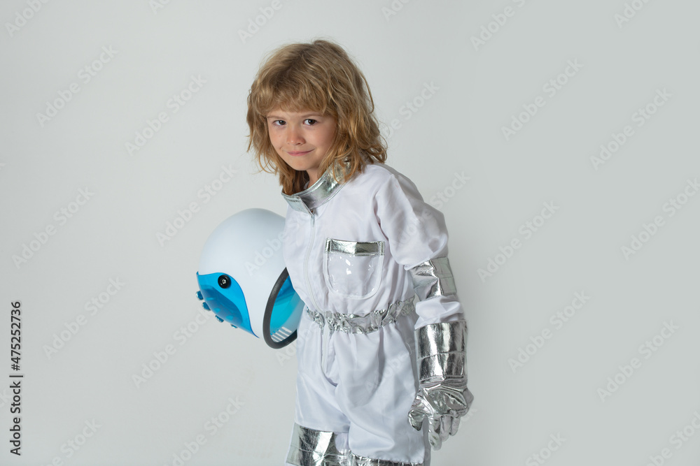 Little boy wearing an astronaut helmet costume and. Cute kid in