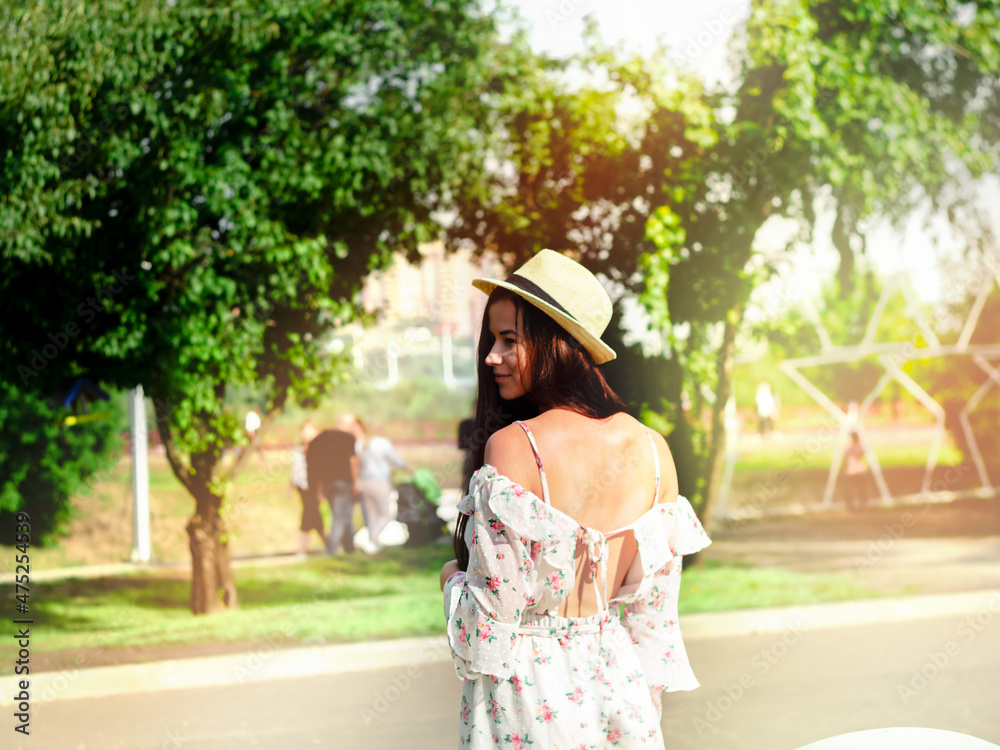 Colorful portrait of a girl in a hat on a summer sunny day