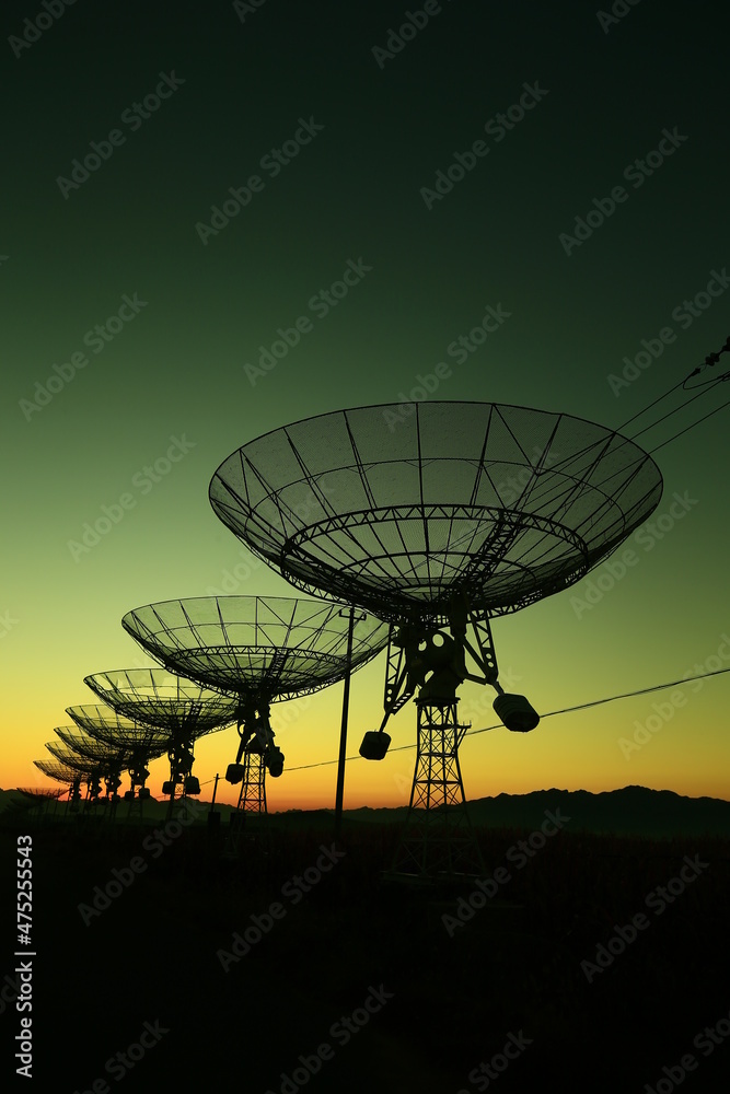 The silhouette of a radio telescope observatory The silhouette of a radio telescope observatory