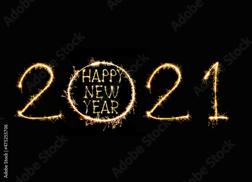Happy New Year 2021 text hand written sparkles fireworks.