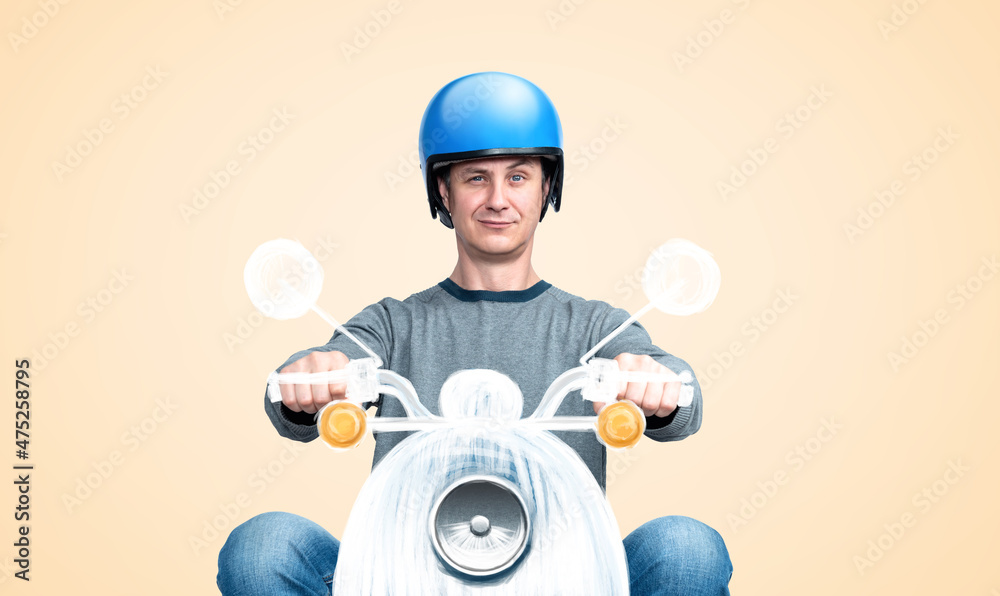 Happy man in a blue motorcycle helmet drives an imaginary motor scooter on a light yellow background. Front view. Happiness dream concept. Happy man in a blue motorcycle helmet drives an imaginary motor scooter on a light yellow background. Front view. Happiness dream concept.
