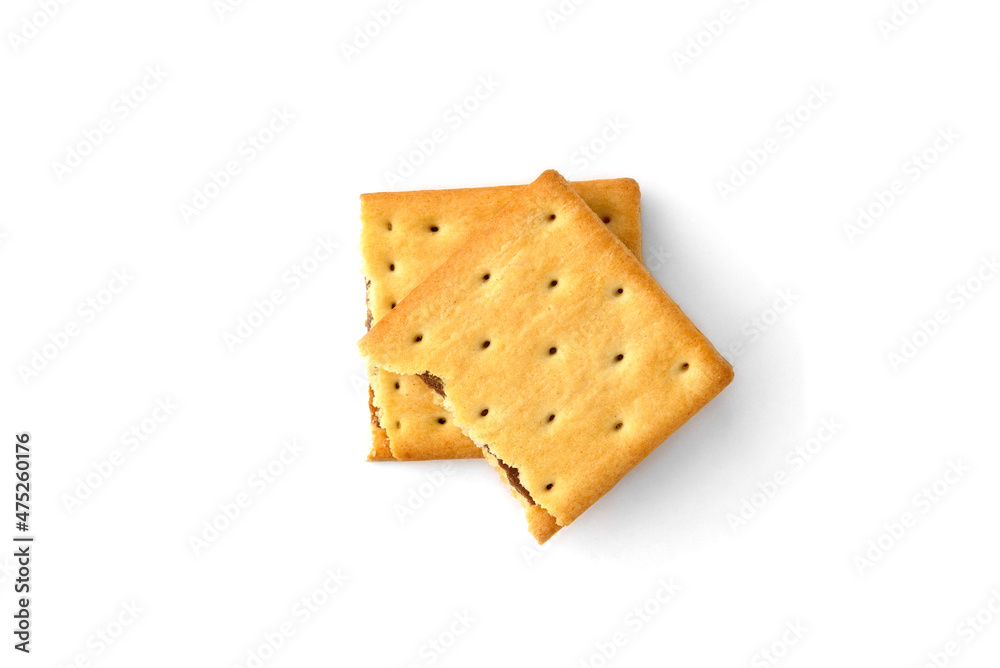 Cracker sandwich with chocolate filling isolated on white background.