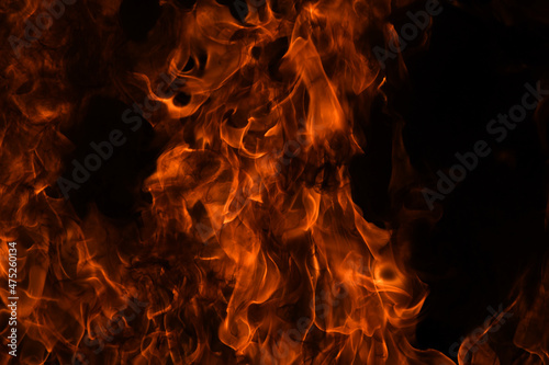 Texture of fire on a black background. Abstract fire flame background, large burning fire.