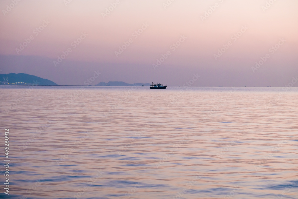 Tranquil sea with sunset view