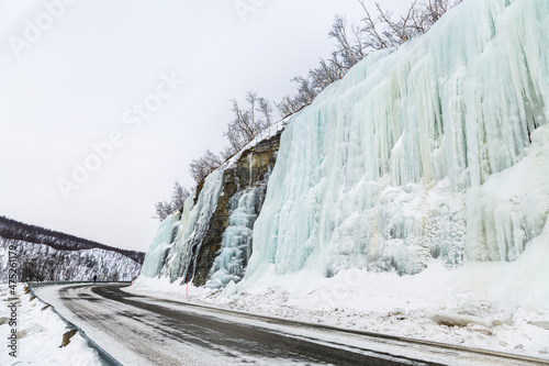 Snowy road with snow and ice waterfalls © Javier