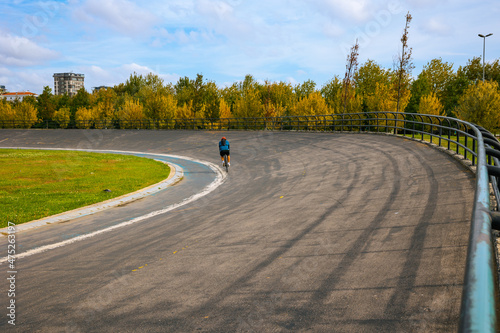 Male Cyclist in Velodrome. Cyclist training in the velodrome in the park.