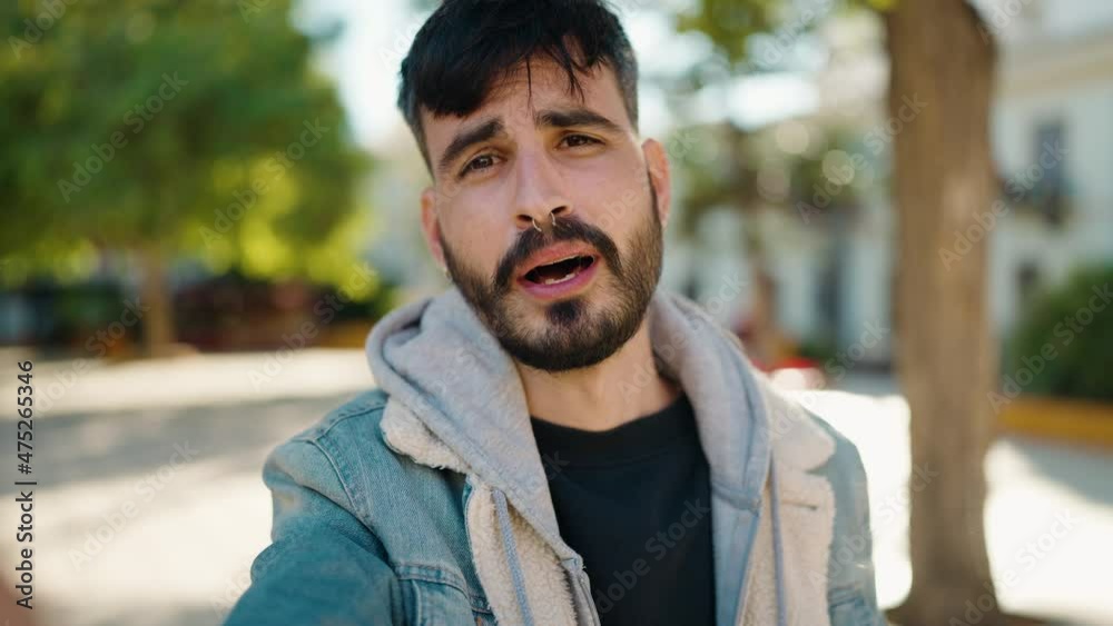 Young hispanic man smiling confident having video call at park Young hispanic man smiling confident having video call at park