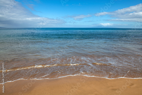 Blue ocean wave on sandy beach. Beach in sunset summer time. Beach landscape. Tropical seascape  calmness  tranquil relaxing sunlight.