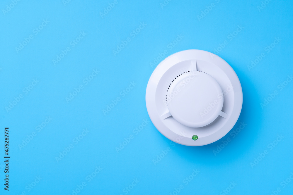 Fire detector on a blue background. Copy-space Fire detector on a blue background. Copy-space