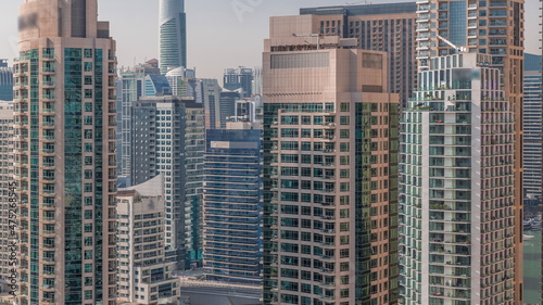 Dubai Marina Skyline with JLT district skyscrapers on a background aerial timelapse.