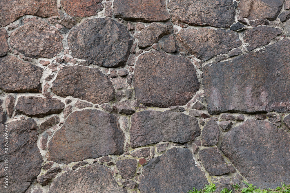 the texture of the finishing stone on the wall. Natural stone