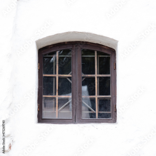 A small window with a lattice in the old tower