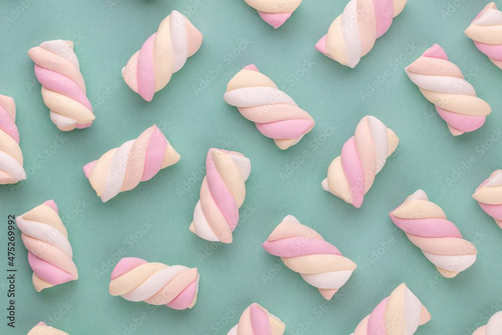 Colorful marshmallow laid out on pastel background. Creative textured pattern. Colorful marshmallow laid out on pastel background. Creative textured pattern.