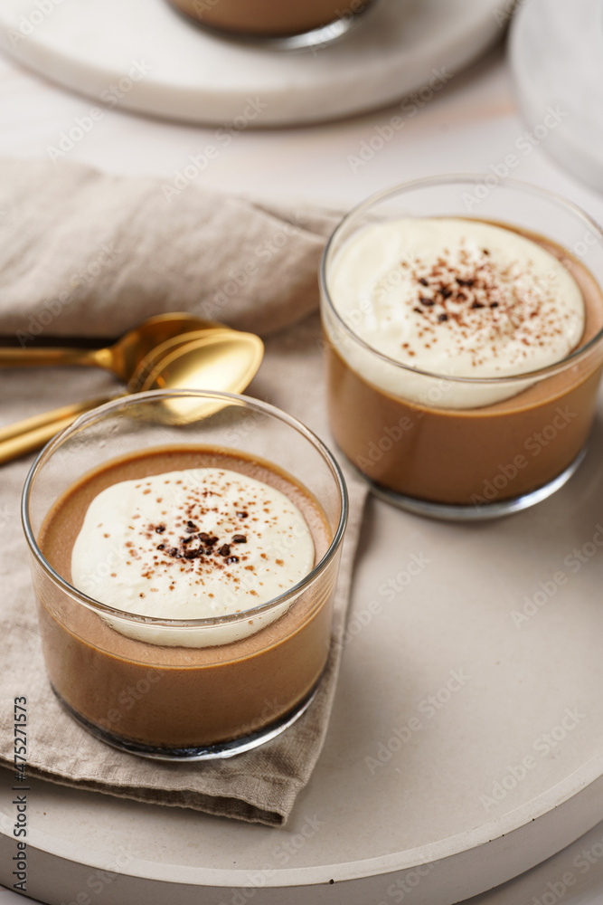 Italian chocolate and coffee mousse dessert semifreddo - half-frozen ice cream with whipped cream and cocoa powder in small glasses Italian chocolate and coffee mousse dessert semifreddo - half-frozen ice cream with whipped cream and cocoa powder in small glasses