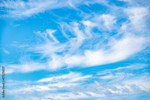 Stratus-cirrus high-altitude clouds in the stratosphere. Background with white clouds floating above the ground at flight altitude. Picture for weather forecast. Nature  air  freedom.