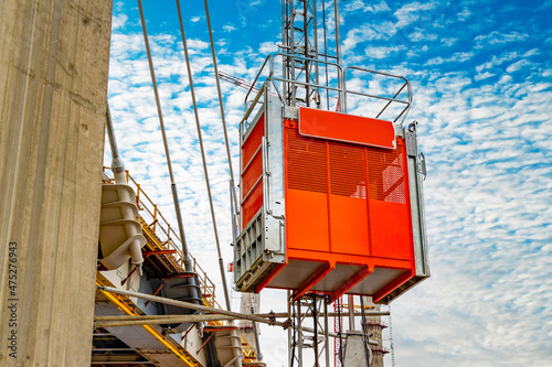 Canvas-taulu Construction elevator, lifts workers towards the new cable-stayed bridge under construction