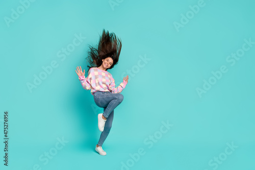 Full length body size view of charming cheery girl dancing having fun isolated over bright teal turquoise color background