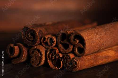 cinnamon and cassia sticks are close. brown condiment sticks on the side © SVETLANA