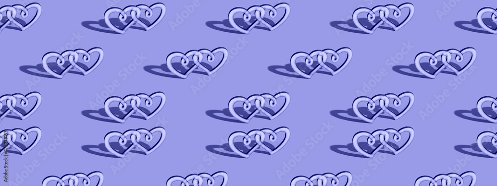 Fototapeta premium Wooden double heart in a trendy color, very peri. Seamless patterns. Celebrating Valentine's Day copy space.