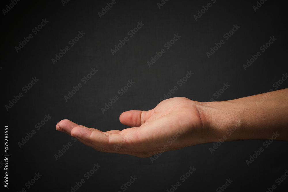Concept homeless and destitute.Hand of a man asking for alms. Concept homeless and destitute.Hand of a man asking for alms.