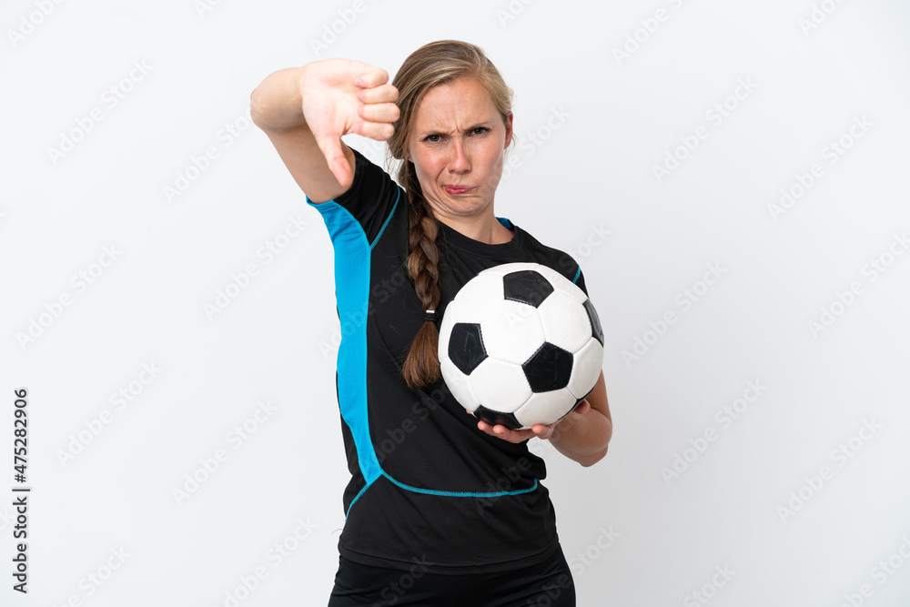 Young football player woman isolated on white background showing thumb down with negative expression