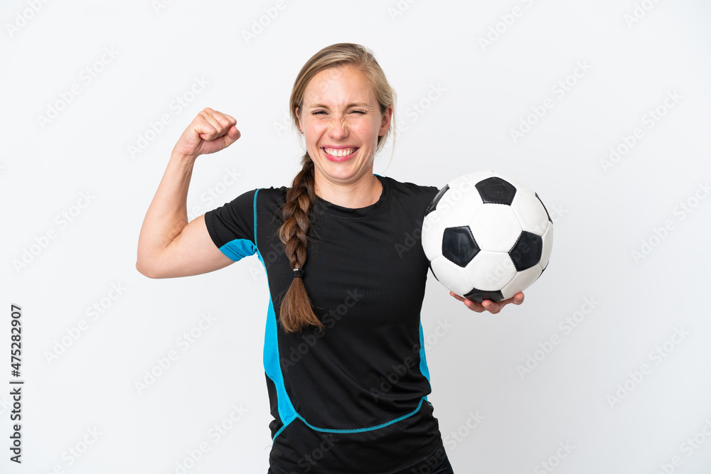 Young football player woman isolated on white background doing strong gesture