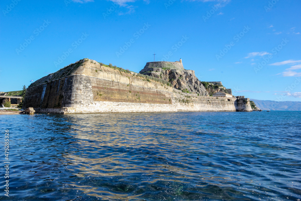 	
Corfu Castle old fort Greek island surrounded by blue sea sky and mountains a tourist attraction in Mediterranean Greece.	
