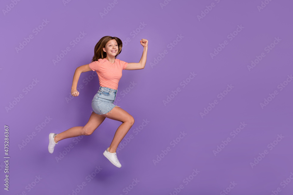 Full length body size view of attractive cheerful funky girl jumping running copy space isolated on bright violet purple color background
