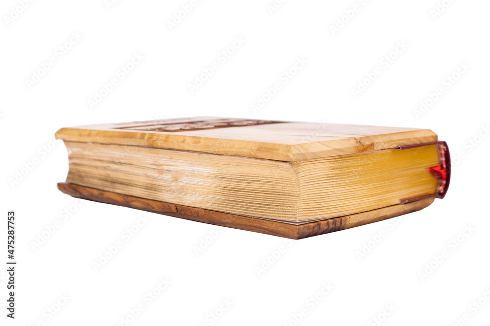 Bible with wooden cover from Jerusalem isolated on white background.