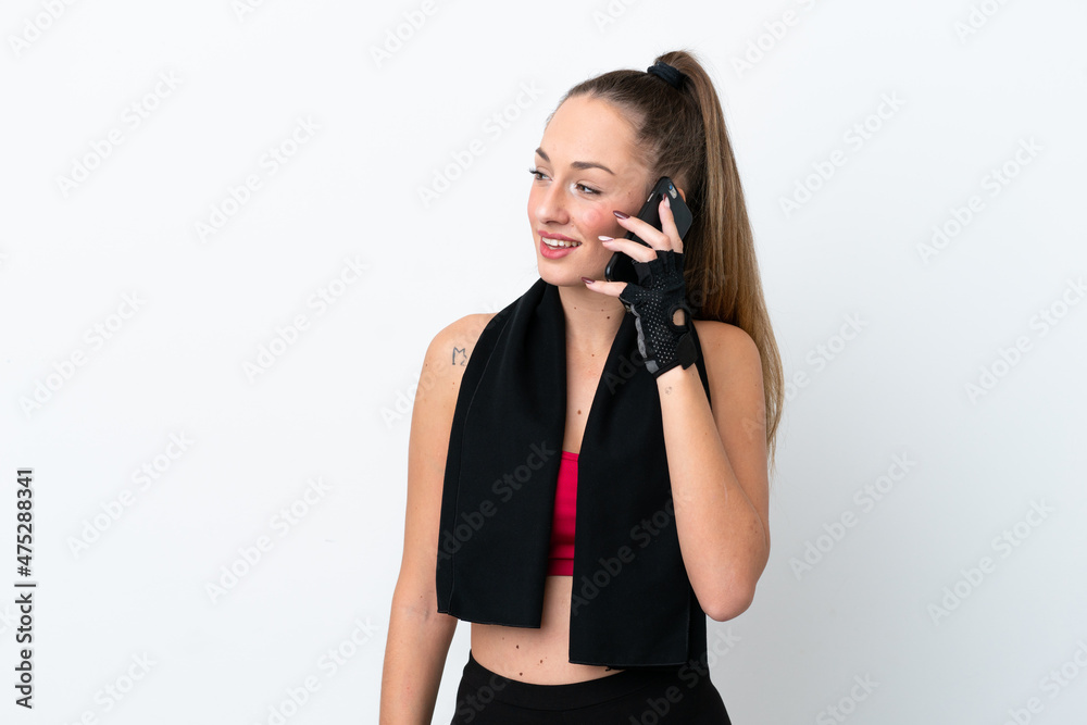 Young sport caucasian woman isolated on white background keeping a conversation with the mobile phone with someone Young sport caucasian woman isolated on white background keeping a conversation with the mobile phone with someone