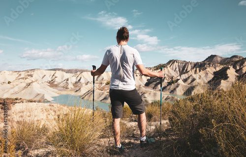 man travel in Spain- Murcia, blue lake and dunes (Embalse Algeciras)