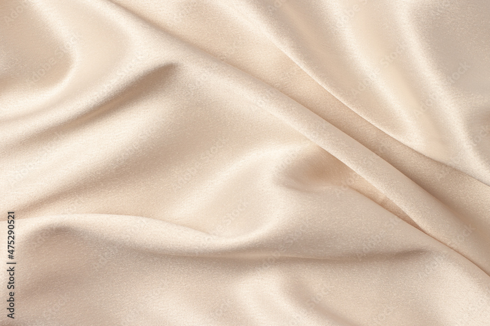 Silk atlas soft tender beige color fabric with shiny curves and waves macro - obrazy, fototapety, plakaty 