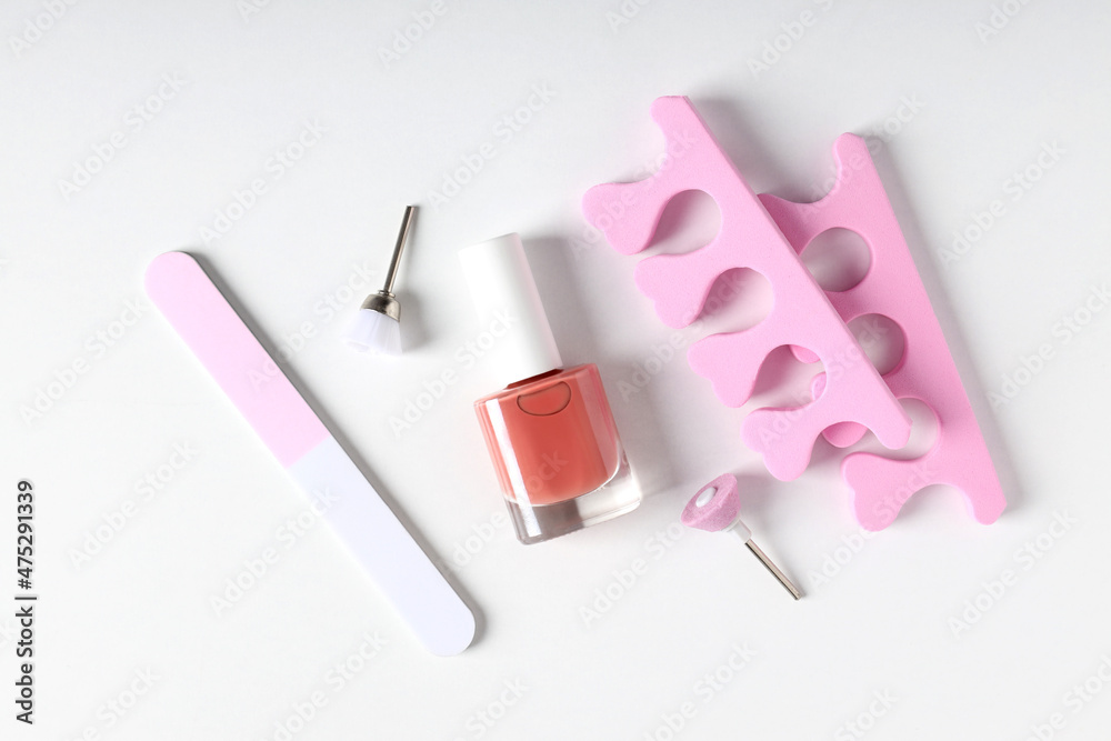 Concept of nail care with manicure accessories on white background